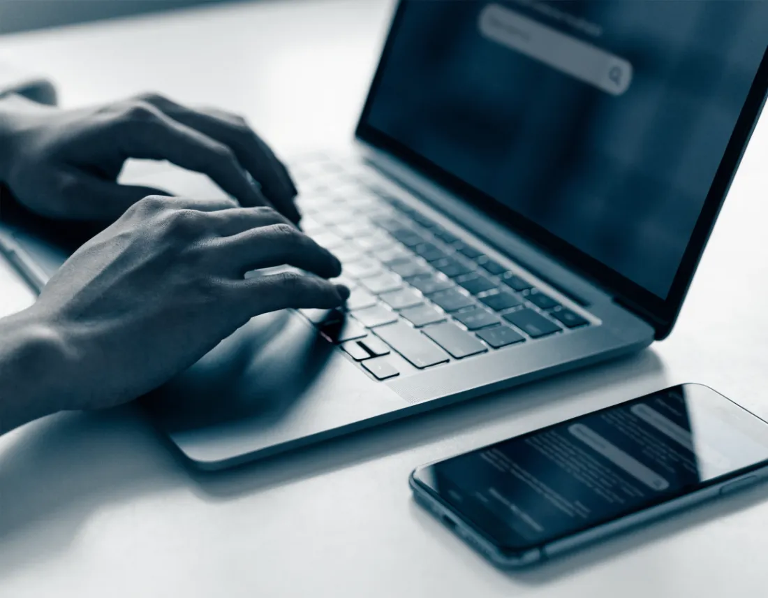 Searching on a laptop and phone